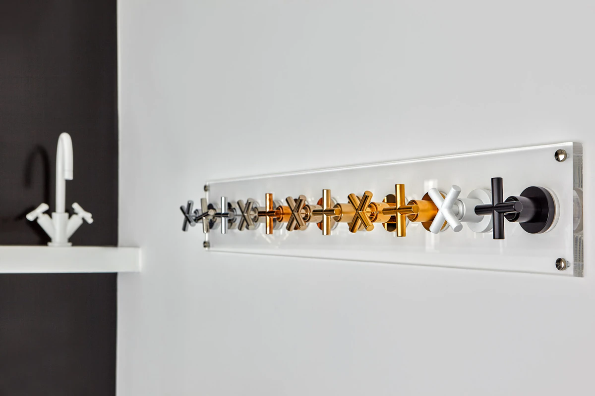 Vickie Comninos — interior design studio, Greece: tapware finishes laid out on a showroom display panel